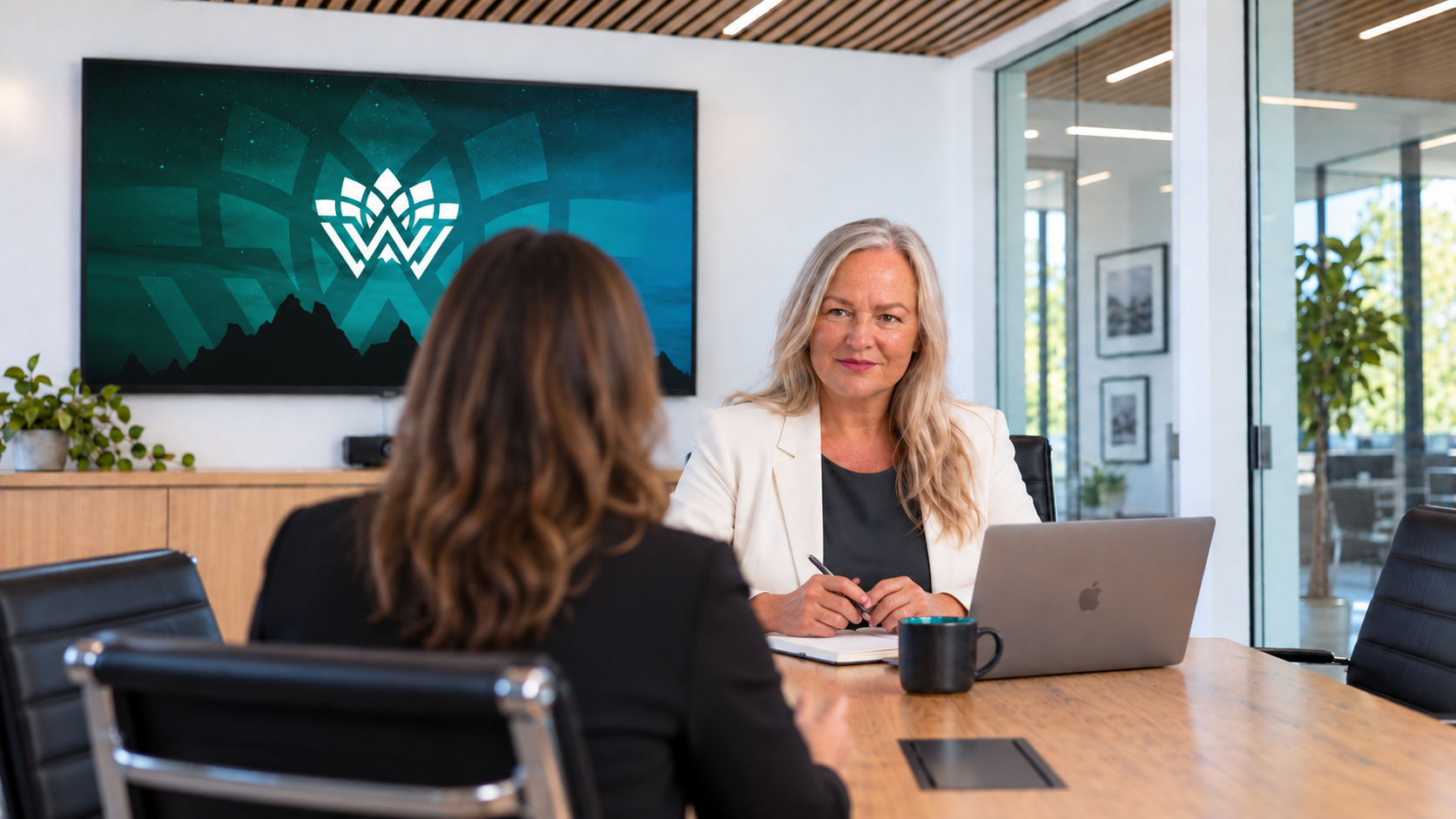 Tania Gorry providing business coaching to an established provider founder in a boardroom